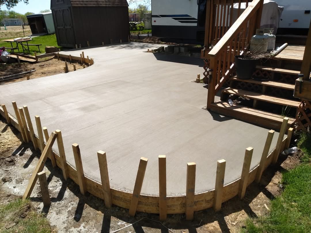 new poured concrete with sticks holding it up