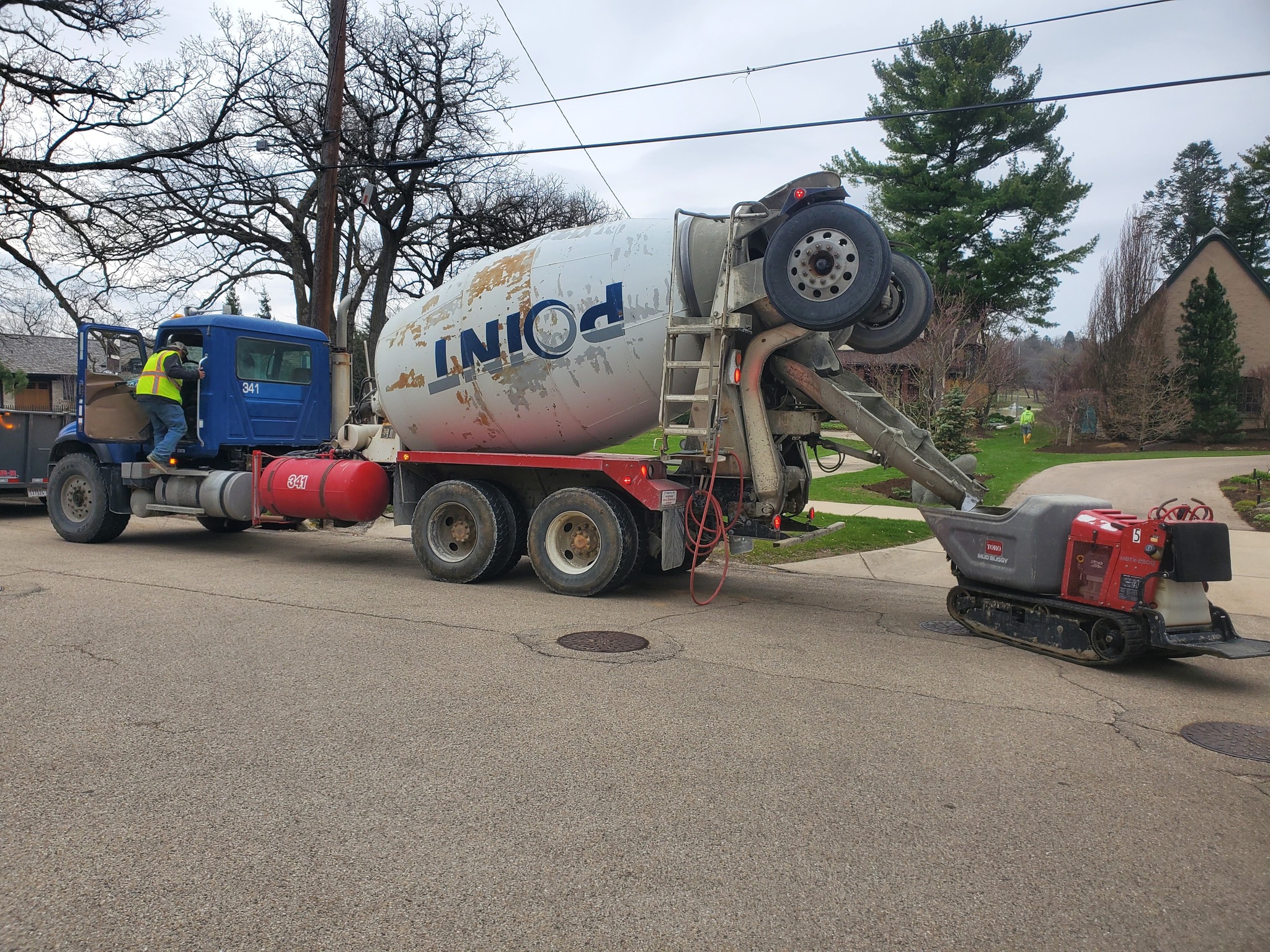concrete truck pouring concrete with equipment